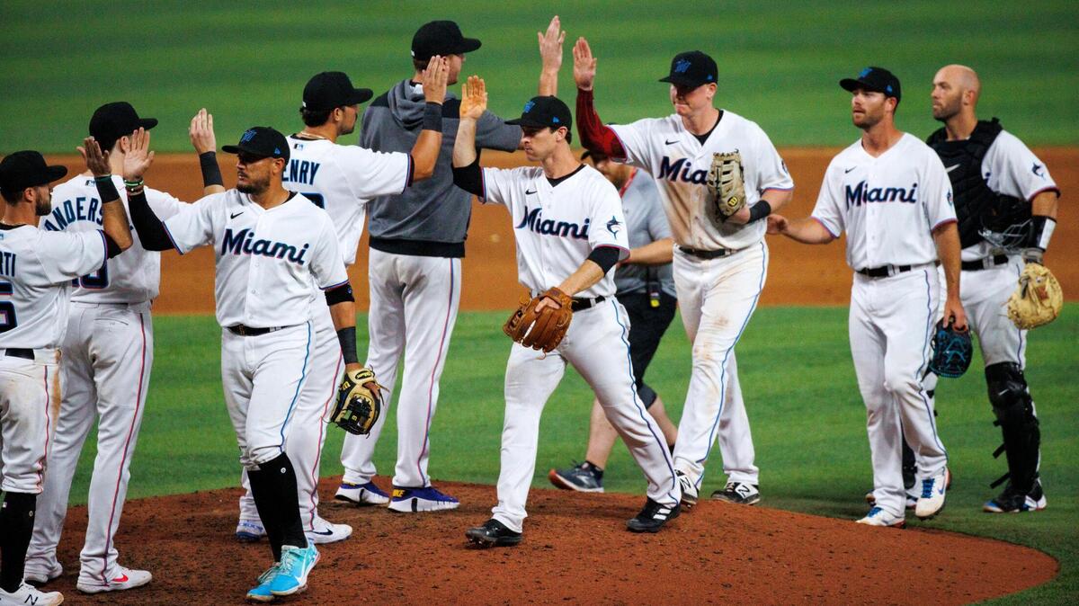 Miami Marlins players celebrate their 4-3 over the Philadelphia Phillies during the season home opener baseball game at LoanDepot Park on Thursday, April 14, 2022 in Miami, Florida.