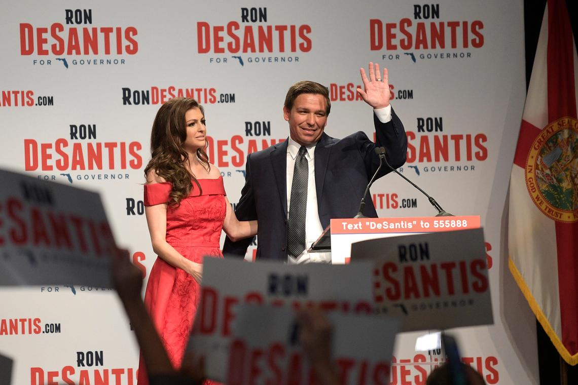 Florida Republican gubernatorial candidate Ron DeSantis, right, waves to supporters with his wife, Casey, at an election party after winning the Republican primary, Tuesday, Aug. 28, 2018, in Orlando.