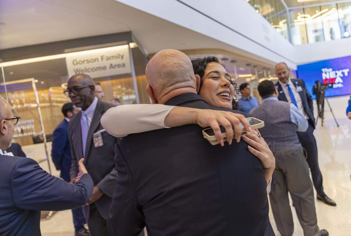 Carlos Migoya, outgoing Jackson Health System chief executive officer, hugs Sen. Alexis Calatayud, R-Miami, during a preview event of a new emergency room at Jackson Memorial Hospital on Thursday, April 16, 2026, in Miami, Fla.