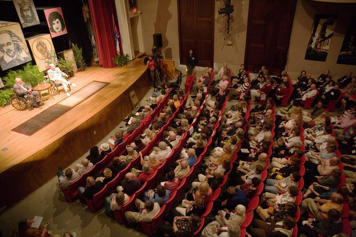 Inside the San Carlos Institute in Key West, the audience listens to a panel discussion between author Gore Vidal and novelist Jay Parini at the 2009 seminar.