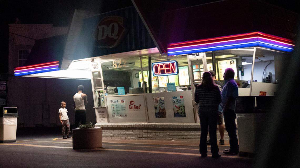 In this file photo, customers wait in line at a Dairy Queen on a warm evening in Palatka, Fla., Wednesday, April 14, 2021.