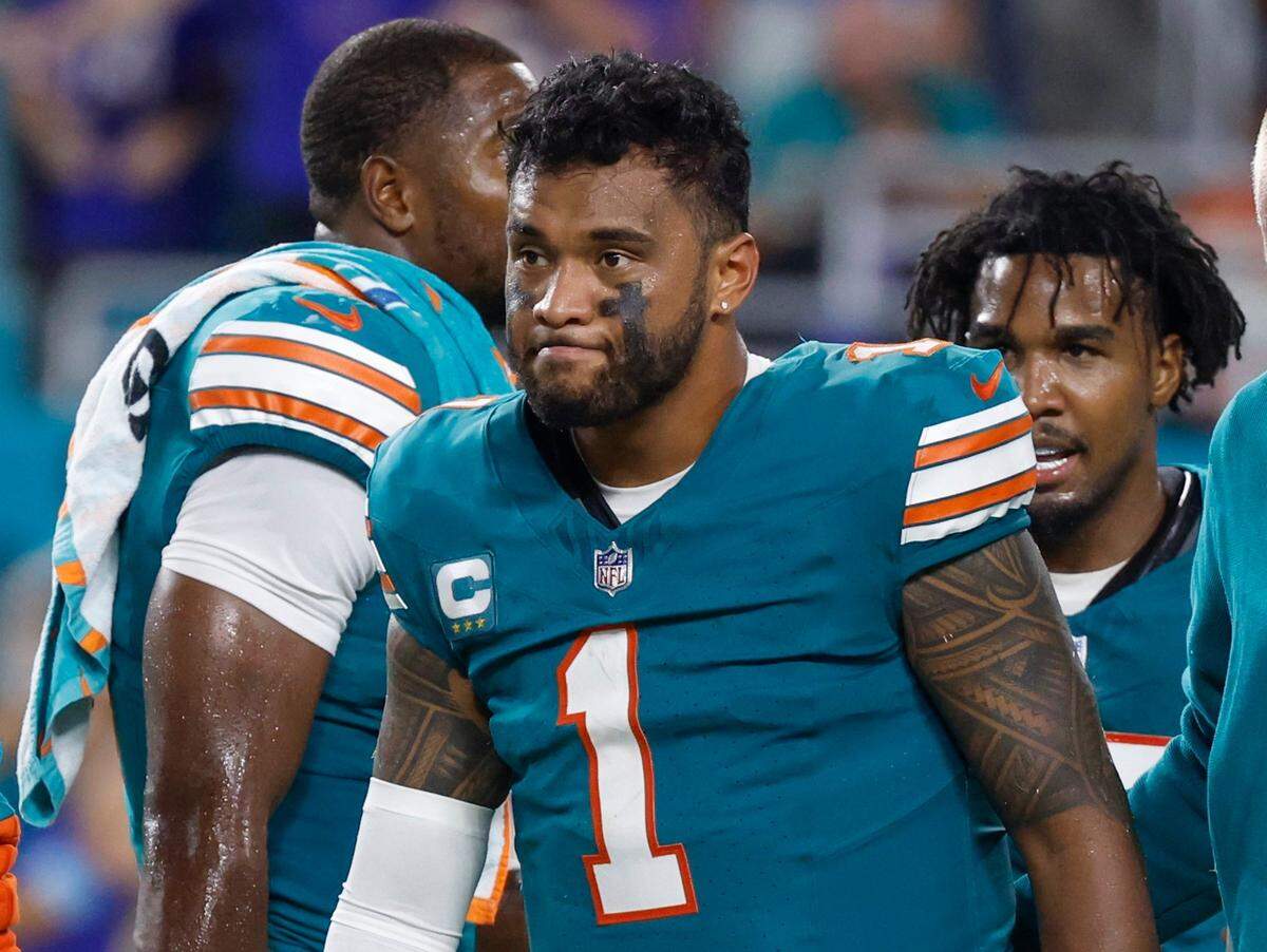 Miami Dolphins quarterback Tua Tagovailoa (1) walks off the field in the third quarter after an injury during the game against the Buffalo Bills in an NFL game at Hard Rock Stadium on Thursday, September 12, 2024.
