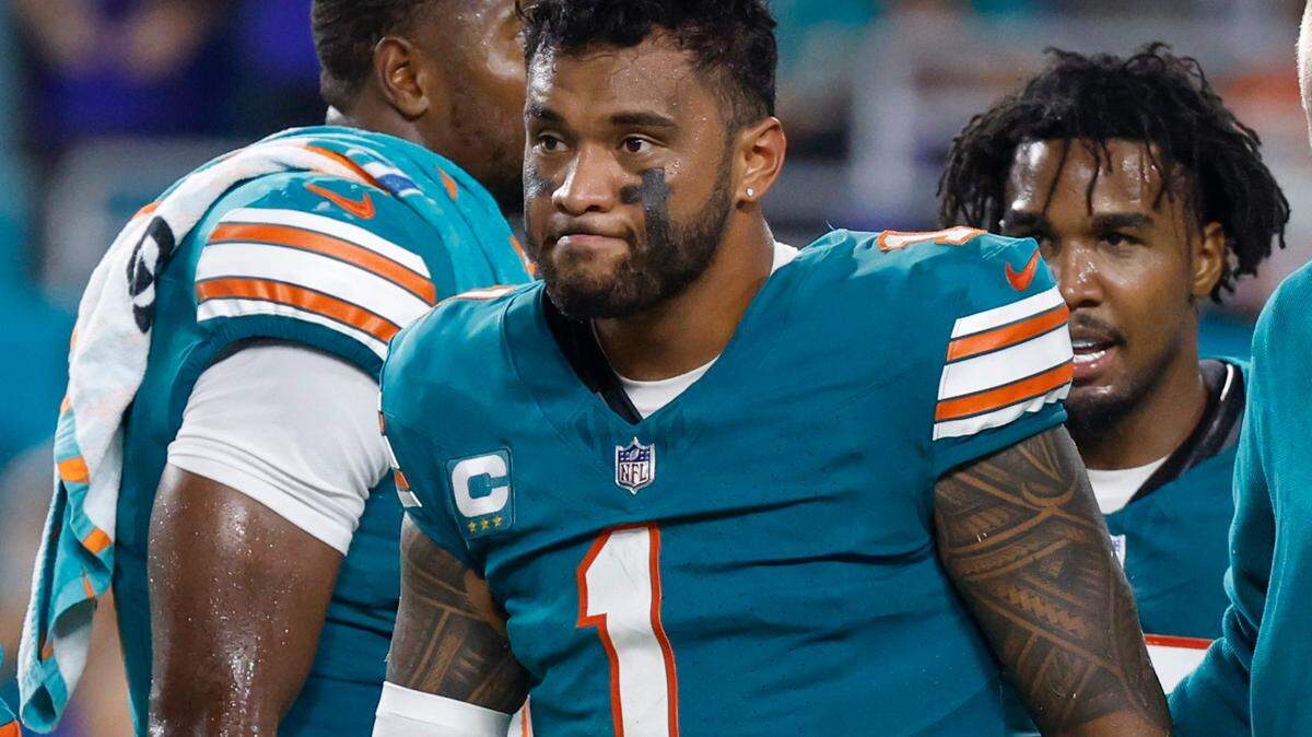 Miami Dolphins quarterback Tua Tagovailoa (1) walks off the field in the third quarter after an injury during the game against the Buffalo Bills in an NFL game at Hard Rock Stadium on Thursday, September 12, 2024.