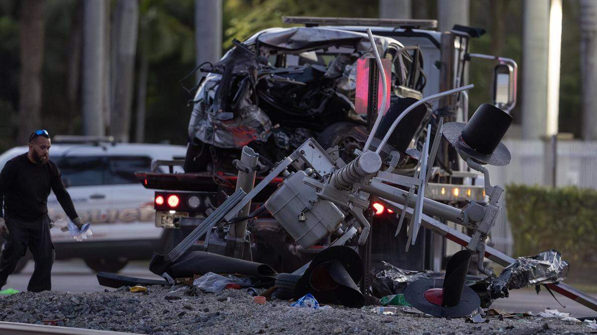 A vehicle involved in a collision with a Brightline train is seen as officials clear the area before it is removed from the crash scene near the 14100 block of Biscayne Boulevard in Miami on Wednesday, Nov. 19, 2025. One person was airlifted to a trauma center.