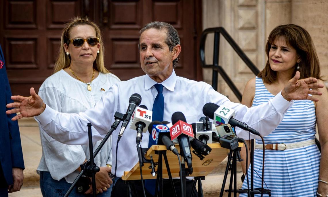 Miami, Florida, August 22, 2022 - Florida Democratic Party Chair, Manny Diaz , center, answers questions from reporters during a press conference held in front of the freedom Tower in downtown Miami. The press conference was called by Democrats in response to comments made by Lt. Governor Jeannette Nuñez. Florida Lt. Gov. Jeanette Nuñez — a Cuban-American Republican from Miami — raised eyebrows among some Cuban Americans over the weekend after appearing to suggest on a conservative AM radio show that Cubans who were in Florida “illegally” would be bused to Delaware.