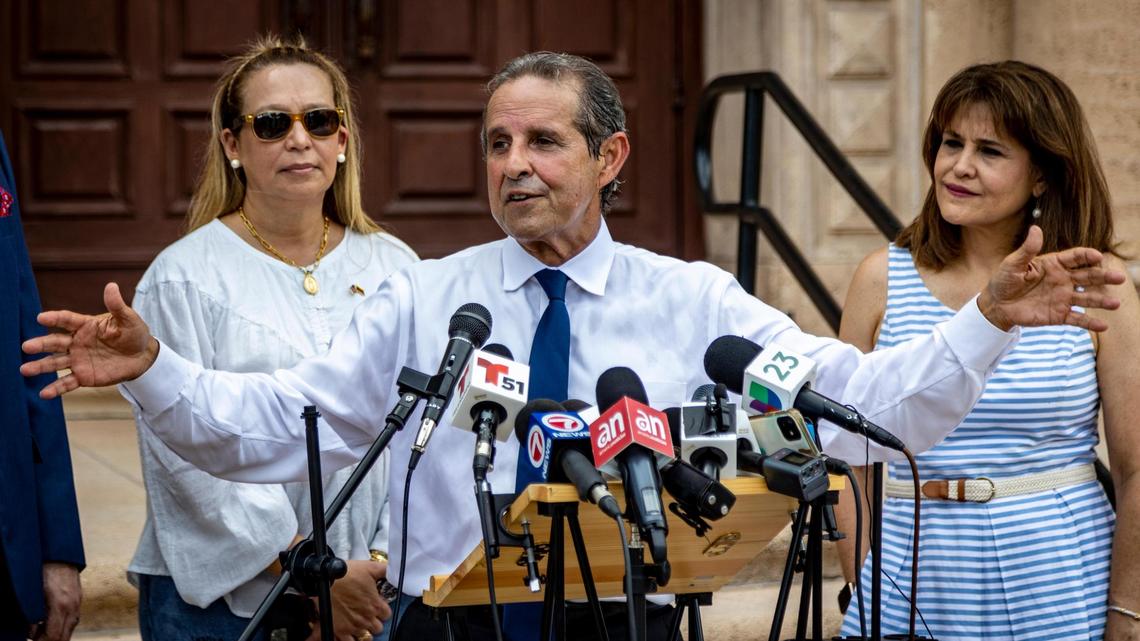Florida Democratic Party Chairman Manny Diaz, center, answers questions from reporters during a press conference held in front of the Freedom Tower in downtown Miami on Aug. 22, 2022. The press conference was called by Democrats in response to comments made by Florida Lt. Gov. Jeanette Nuñez. Nuñez, a Cuban-American Republican from Miami, raised eyebrows among some Cuban Americans over the weekend after appearing to suggest on a conservative AM radio show that Cubans who were in Florida “illegally” would be bused to Delaware.