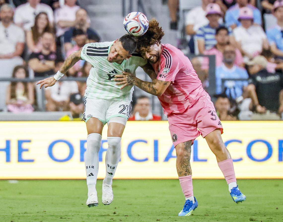 Austin FC forward Christian Ramírez (21) and Inter Miami CF defender Maximiliano Falcón (37) head the ball in the first half of their MLS match at Nu Stadium in Miami Freedom Park on Saturday, April 4, 2026, in Miami, Florida.