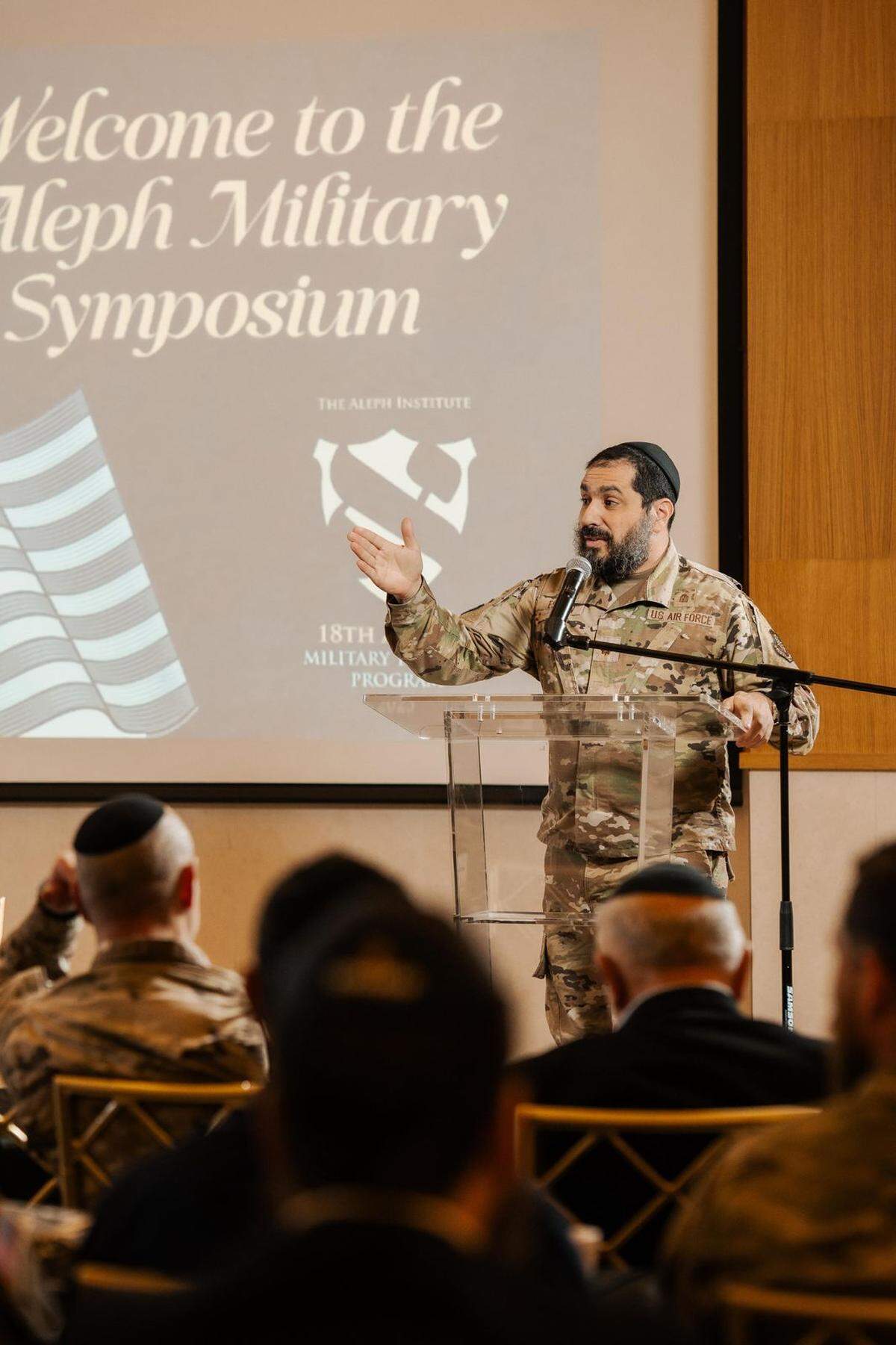 Rabbi Elie Estrin speaks to Jewish military chaplains, service members, and their families at a military training conference hosted by Aleph Institute in Surfside.