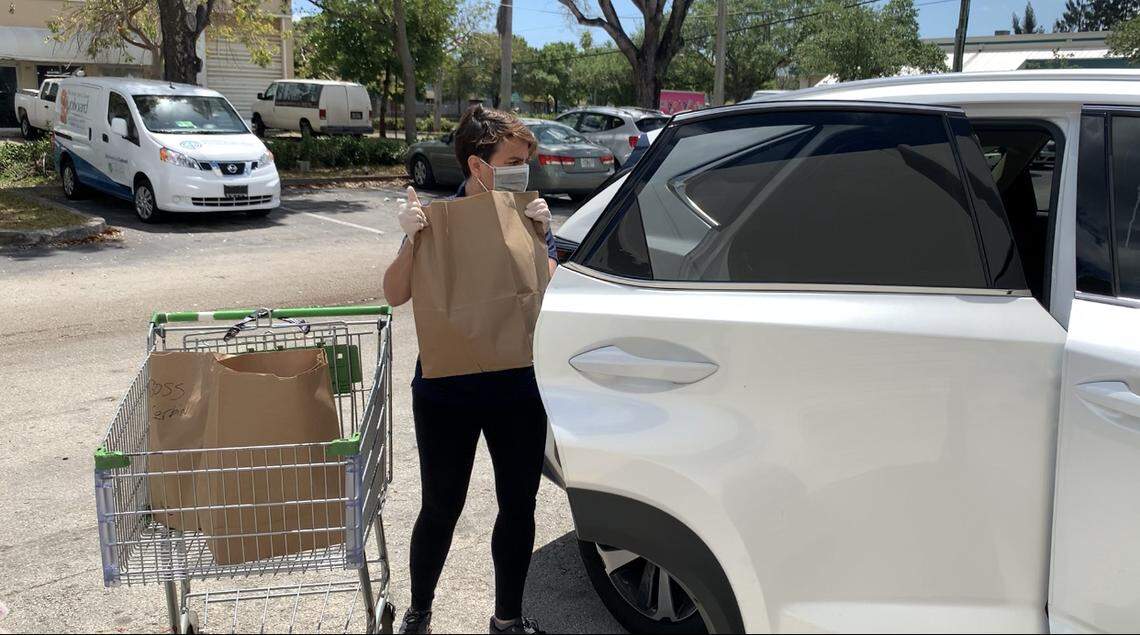Vicky Fried, administrative assistant for the Doris & Ben J. Genet Cupboard, a service of Goodman Jewish Family Services of Broward County, handed out Passover food April 2, 2020.