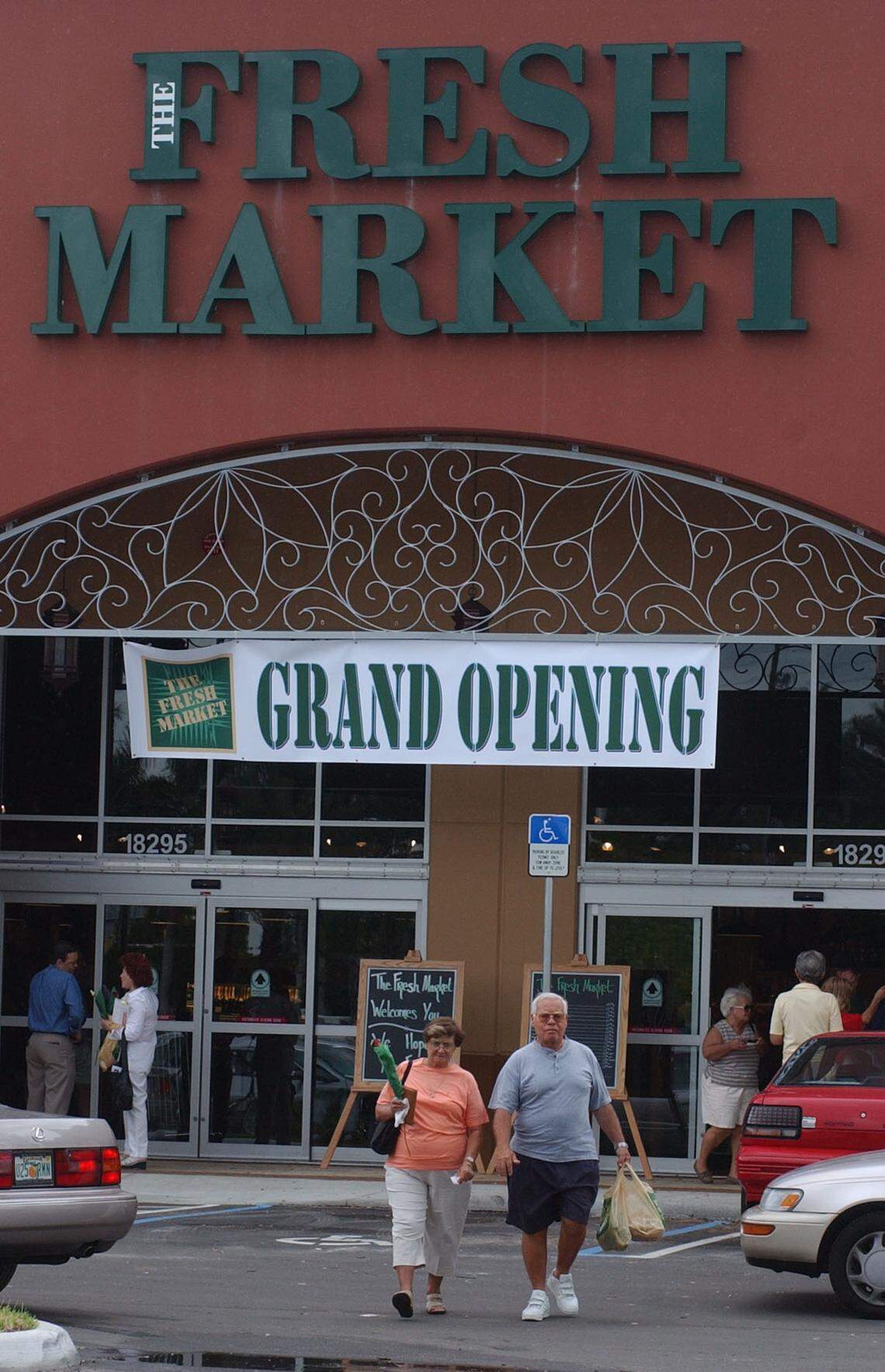 In this file photo from May 1, 2003, The Fresh Market at 18295 Biscayne Blvd., held its grand opening. The Greensboro, N.C.-based grocery chain was in the midst of expanding into Florida. At the time, Fresh Market had two stores in Broward, one in Boca, and others around the state. There is a Fresh Market in The Falls in the Kendall area of Miami, too. At this 2003 grand opening the gourmet grocery offered free tastes and a rose.