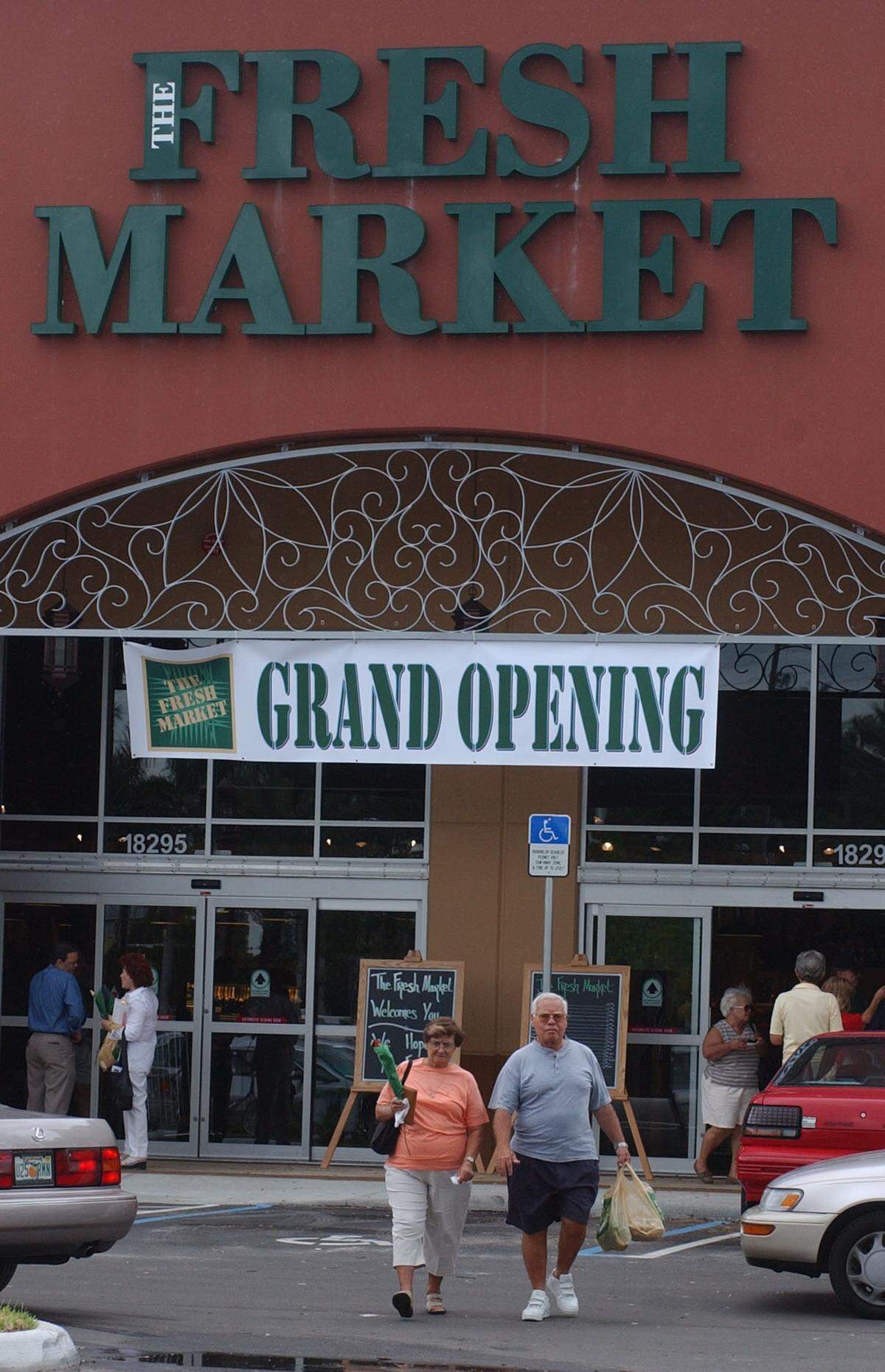 In this file photo from May 1, 2003, The Fresh Market at 18295 Biscayne Blvd., held its grand opening. The Greensboro, N.C.-based grocery chain was in the midst of expanding into Florida. At the time, Fresh Market had two stores in Broward, one in Boca, and others around the state. There is a Fresh Market in The Falls in the Kendall area of Miami, too. At this 2003 grand opening the gourmet grocery offered free tastes and a rose.