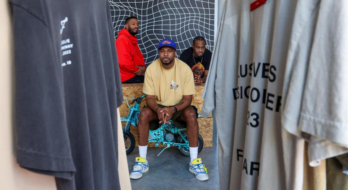 Gallery owners - Jason Wess (center) Keyani Watkins, (right) and artist Anthony “Mojo” Reed II (left) have teamed up to create the show entitled “For Better or Worse,” an exhibit that takes viewers on a journey centered around creativity in spite of circumstance at the Wynwood gallery, Grand Opening Gallery in Miami, Florida.