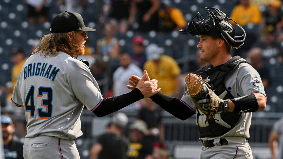 Miami Marlins pitcher Jeff Brigham (43) celebrates with catcher Nick Fortes after defeating the Pittsburgh Pirates in the 10th inning of a baseball game, Sunday, July 24, in Pittsburgh. (AP Photo/Barry Reeger)