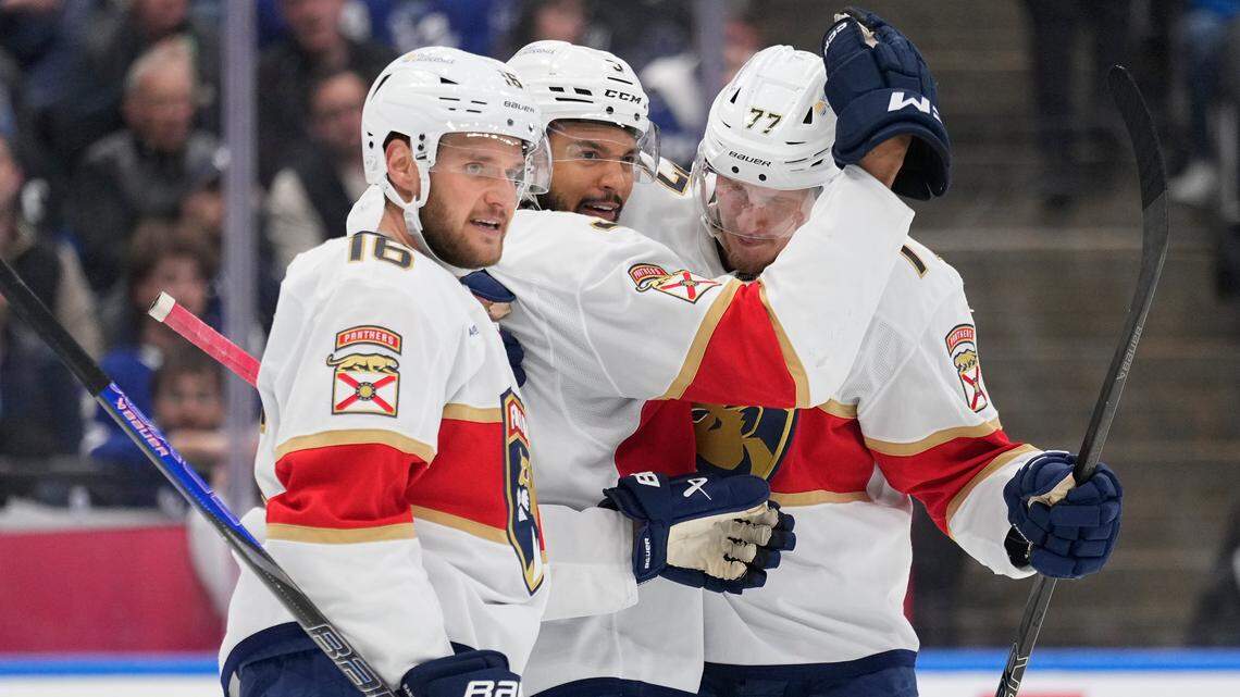 May 18, 2025; Toronto, Ontario, CAN; Florida Panthers defenseman Seth Jones (3) celebrates his goal against the Toronto Maple Leafs with Florida Panthers forward Aleksander Barkov (16) and defenseman Niko Mikkola (77) during the second period of game seven of the second round of the 2025 Stanley Cup Playoffs at Scotiabank Arena. Mandatory Credit: John E. Sokolowski-Imagn Images