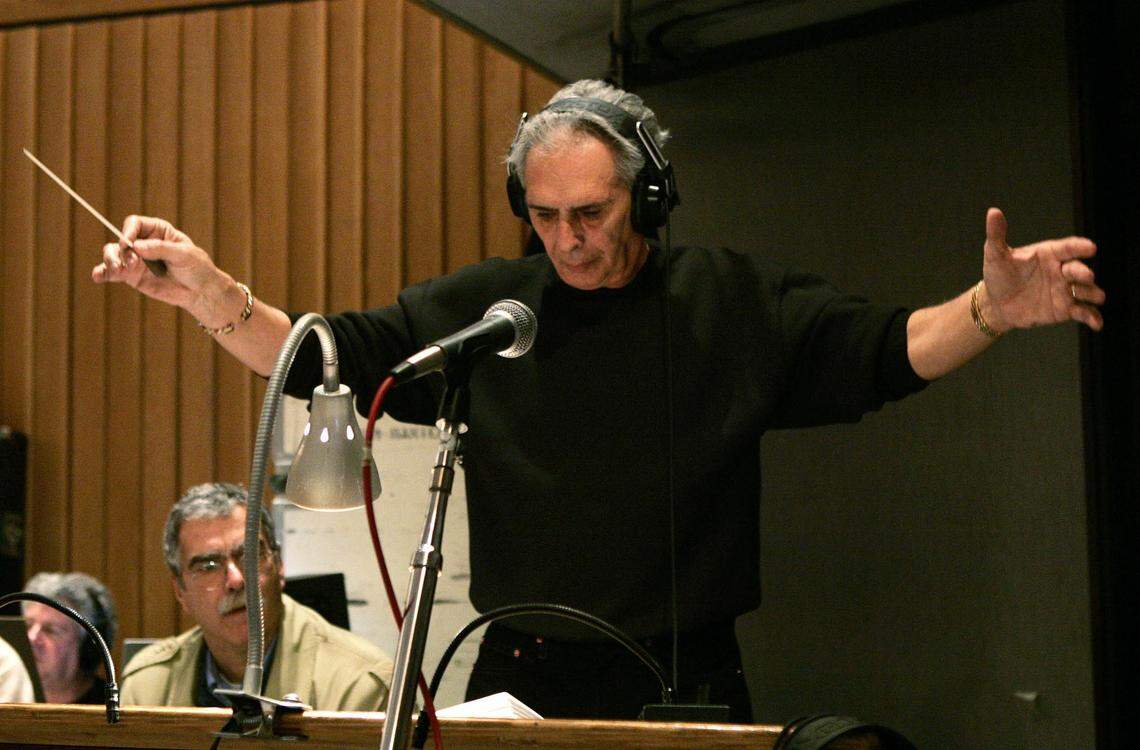 In this file photo from Feb. 21, 2005, Bill Conti conducts the orchestra heard at the 77th Academy Awards. Conti, a North Miami High graduate, won an Oscar in 1983 for his score for “The Right Stuff” and is famed for his “Rocky” music in 1976. 