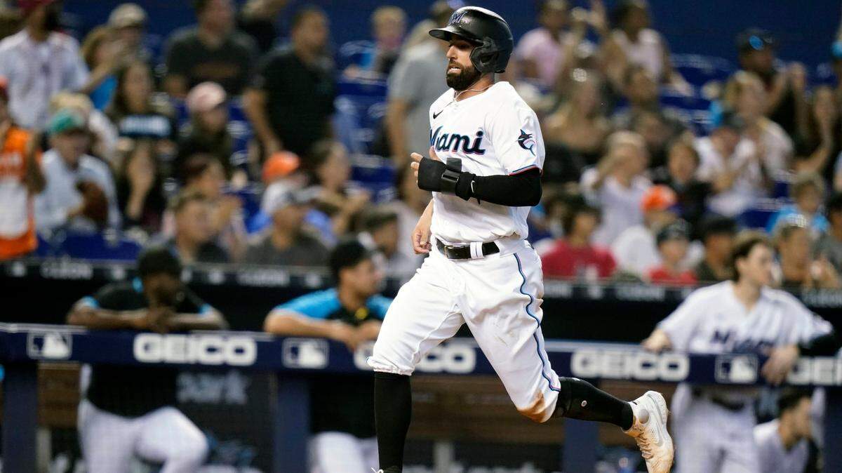Miami Marlins’ Deven Marrero runs home to score on a double hit by Magneuris Sierra during the fifth inning of a baseball game against the San Diego Padres, Sunday, July 25, 2021, in Miami. (AP Photo/Lynne Sladky)
