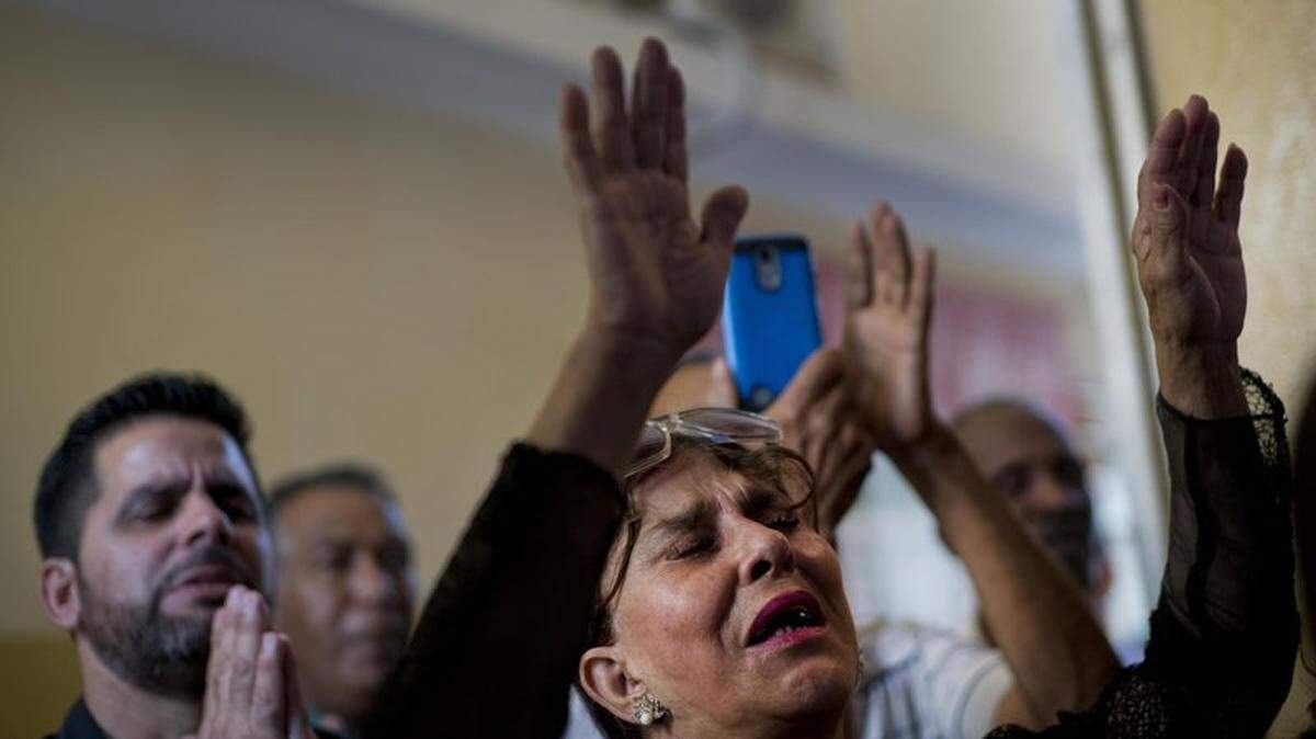 Evangelicals pray during a church service in Havana, Cuba, in February 2019.