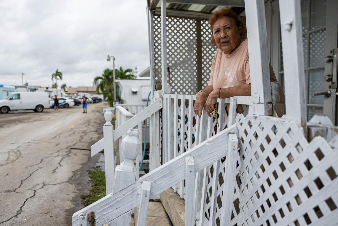 Guil Cardenas, 75, looks on from the entrance to her residence at Royal Palm Mobile Home Park on Thursday, June 13, 2024, in Hallandale Beach, Florida. Residents at the mobile home park are dealing with the aftermath of Wednesday’s storm that left their community flooded.