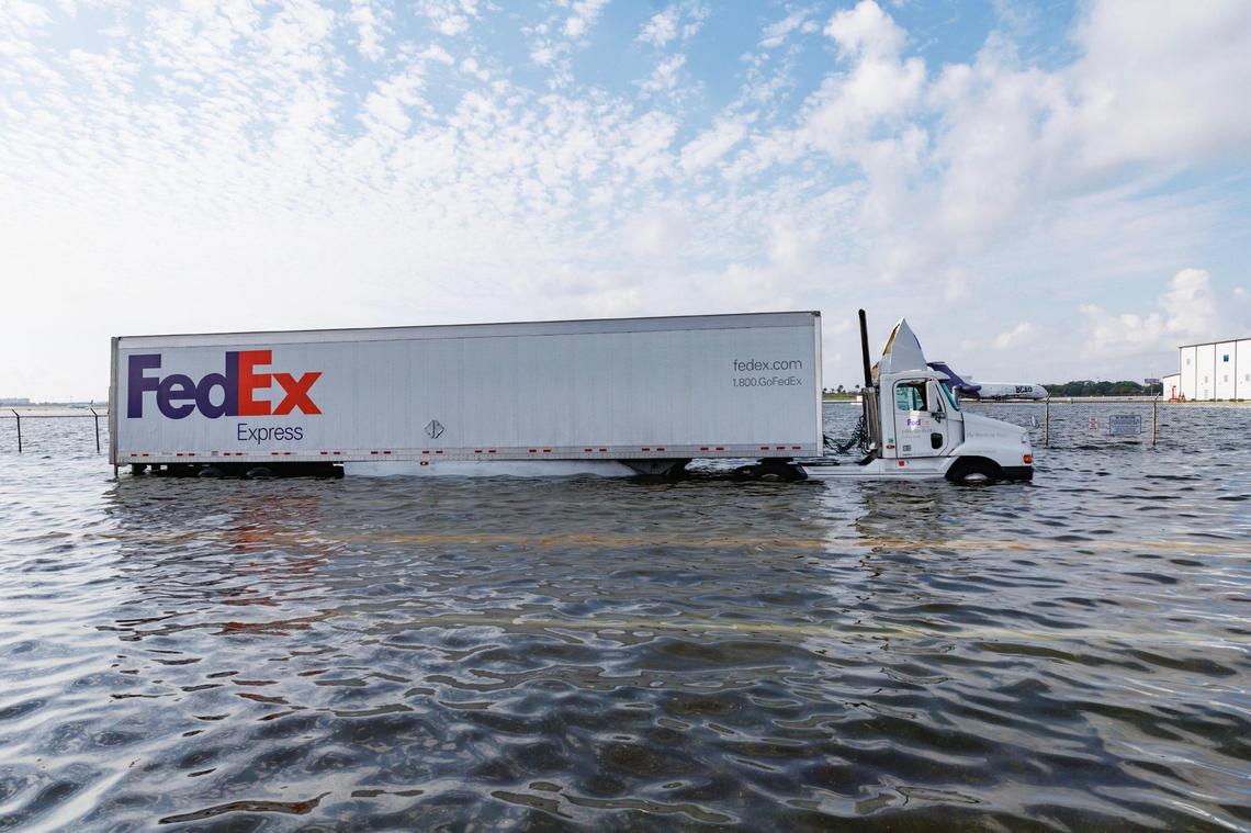 A Fedex truck on flooded West Perimeter Road in Fort Lauderdale on Thursday, April 13, 2023.
