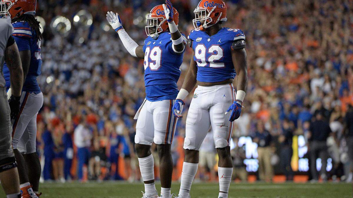 Florida defensive lineman Jabari Zuniga (92) and defensive lineman Jachai Polite (99) line up for a play during the first half of an NCAA college football game against Charleston Southern Saturday, Sept. 1, 2018, in Gainesville.