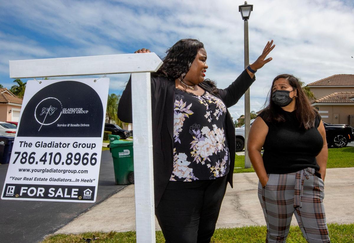 Dawn N. Reid Broker/CEO of Gladiator Realty Group shows her client Melissa Usubillaga a property for sale located in Cutler Bay, Florida, on Friday, March 4, 2022.