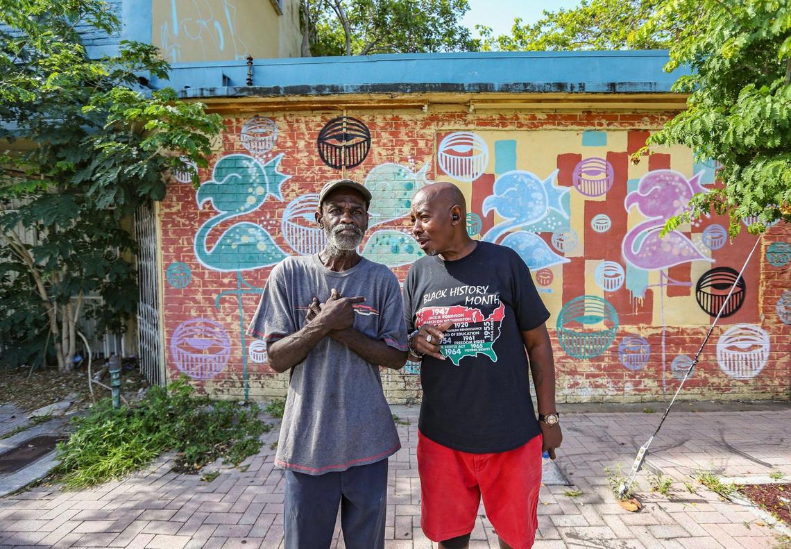 Lifelong residents Michael Williams, 63, and Randy Russ, 67, stand in front of the shuttered Tikki Club on Grand Avenue in the western section of Miami’s Coconut Grove neighborhood on Thursday, June 16, 2022.