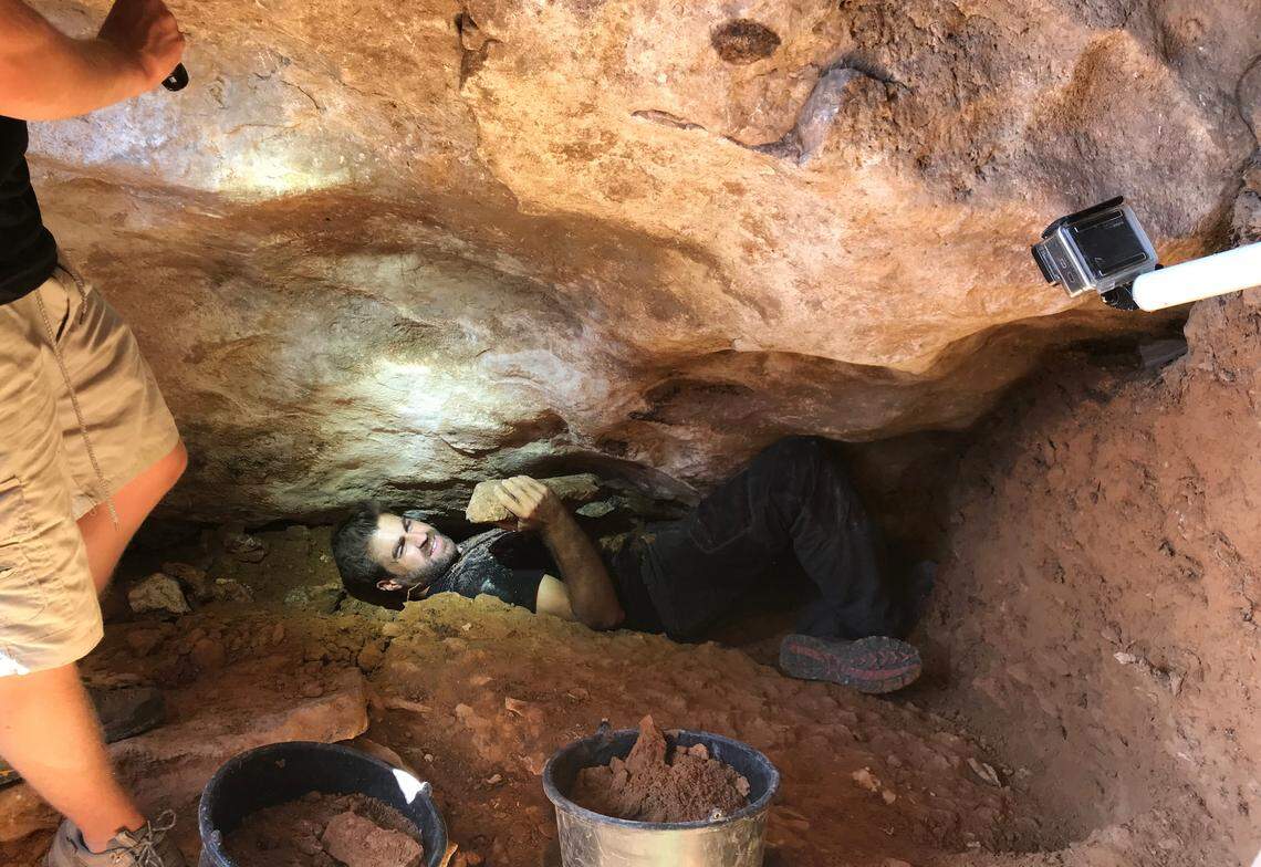 Researchers digging into the sealed passageway.