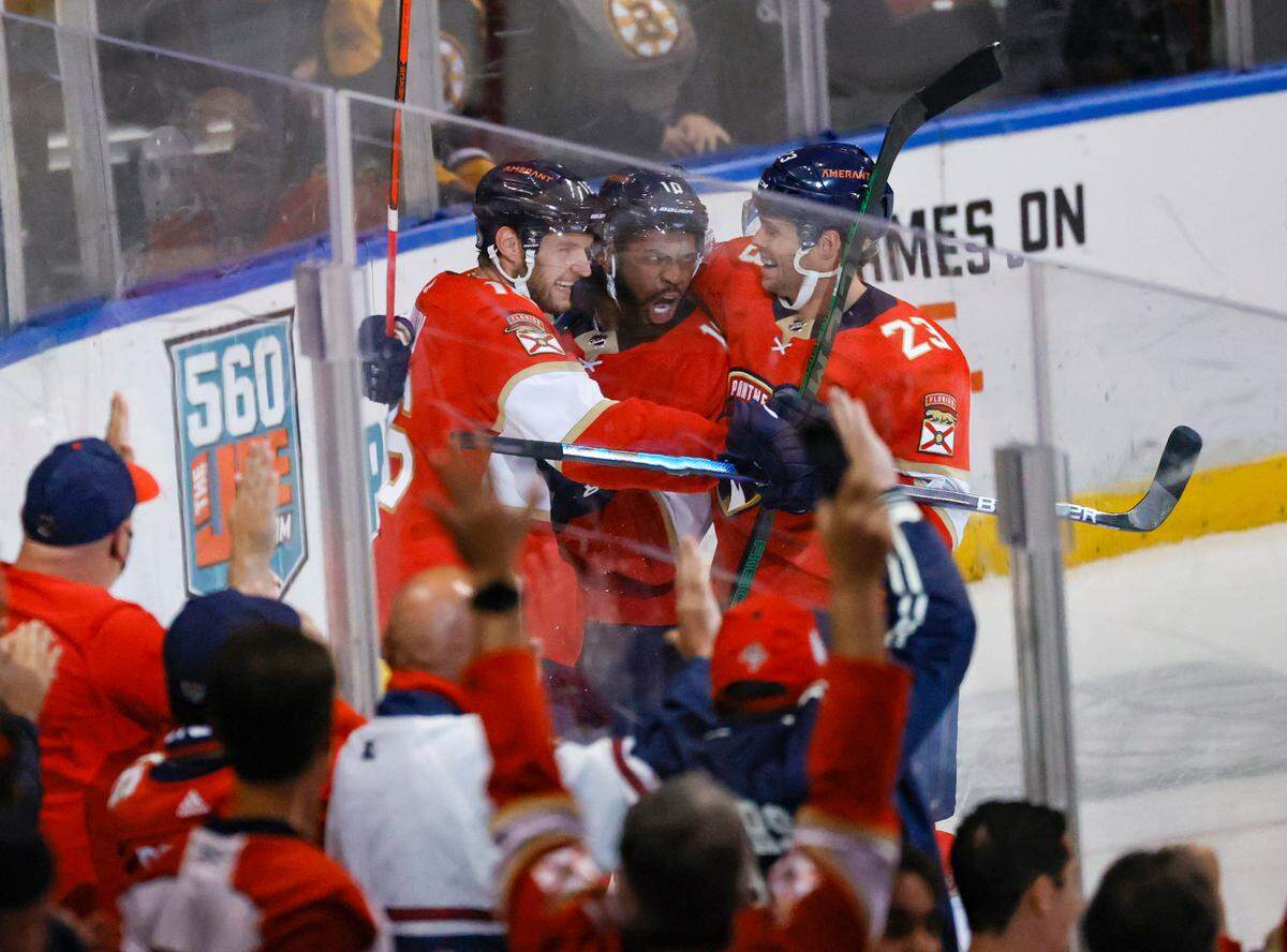 Florida Panthers left wing Anthony Duclair (10) is congratulated by Aleksander Barkov (16) and Carter Verhaeghe (23) after scoring a goal against Boston Bruins goaltender Linus Ullmark (35) during the third period of an NHL game at the FLA Live Arena on Wednesday, October 27, 2021 in Sunrise, Fl.