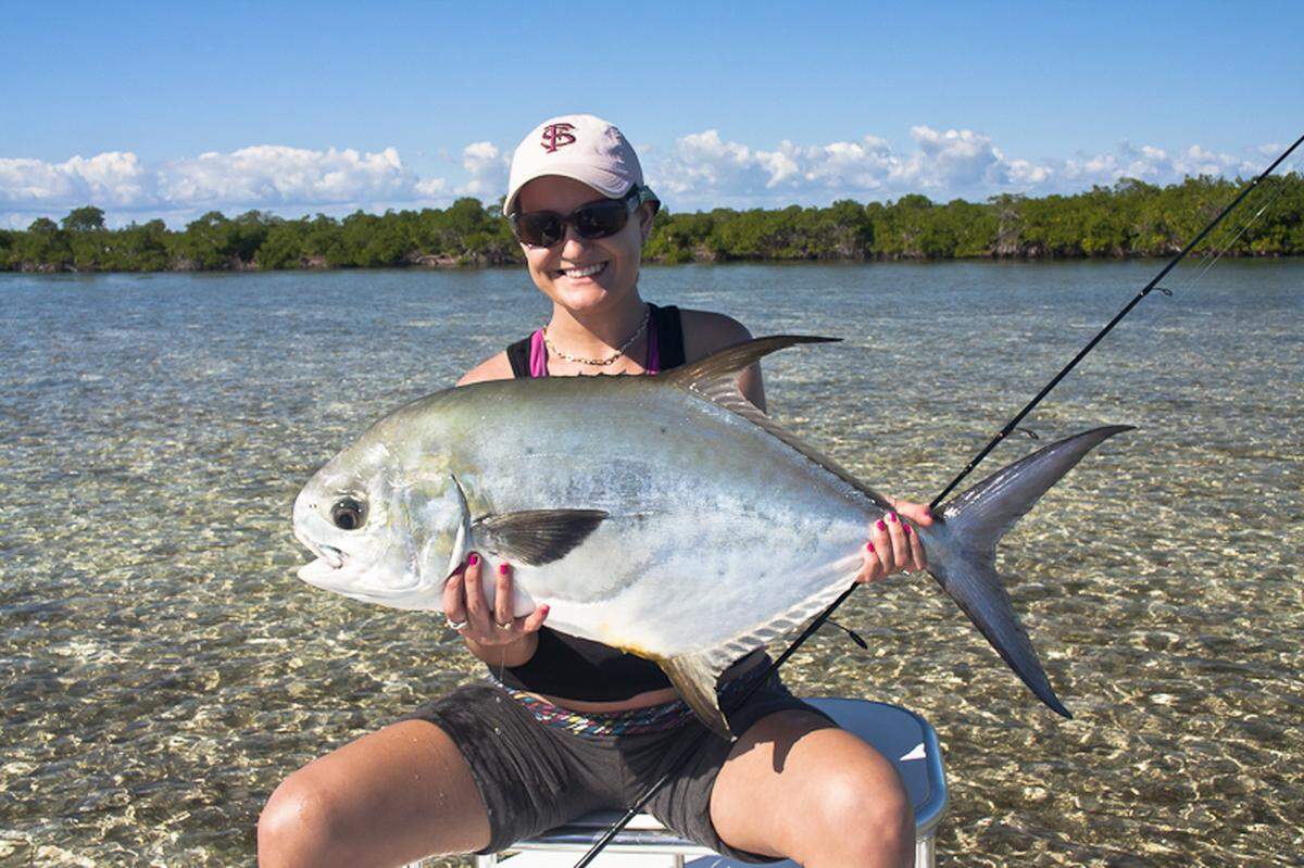 Angler Jen Bobay holds a permit caught in Biscayne Bay, part of a protected zone that stretches through the Florida Keys that prohibits permit from being commercially harvested. Photo courtesy Bob Branham.
