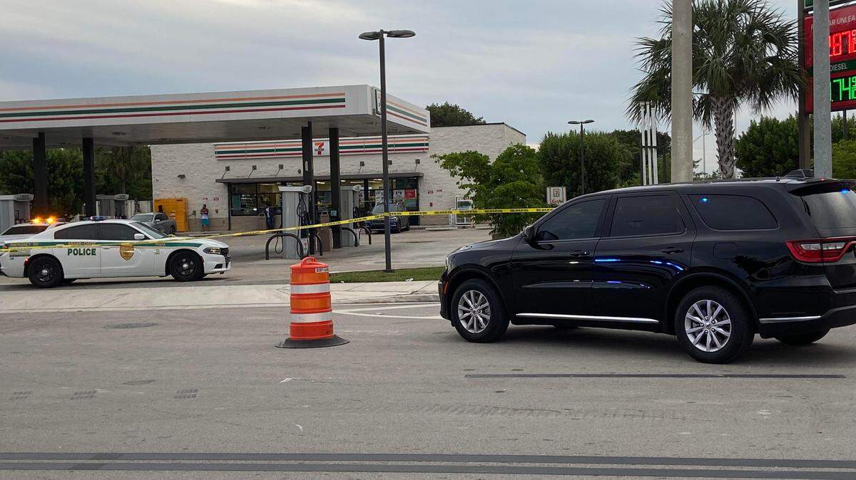 Police tape off a parking lot of a 7-11 gas station and convenience store at Southwest 268th Street and U.S. 1 Monday, Dec. 11, 2023, following a shooting that wounded on man.