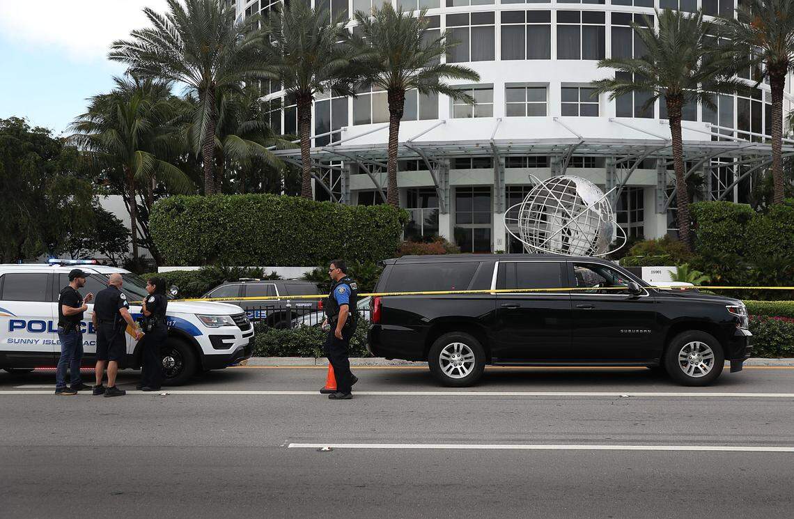 Sunny Isles Beach police officers work near the black Suburban SUV that reports say is the vehicle rapper NBA Youngboy was riding in when a shooting took place on May 12, 2019, in Sunny Isles Beach, Florida. Police continue to investigate the scene in front of Trump International Beach Resort.