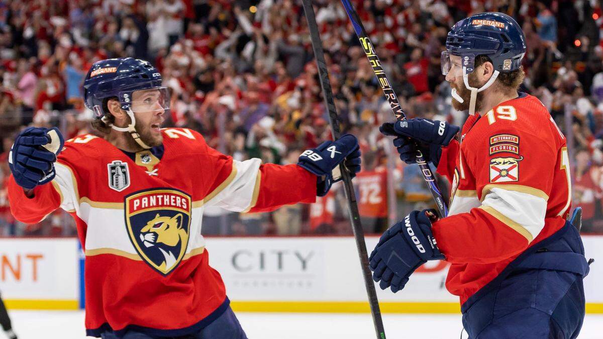 Florida Panthers left wing Matthew Tkachuk (19) celebrates with center Carter Verhaeghe (23) after scoring a goal to tie the game against the Vegas Golden Knights in the third period of Game 3 of the NHL Stanley Cup Final at the FLA Live Arena on Thursday, June 8, 2023, in Sunrise, Fla.