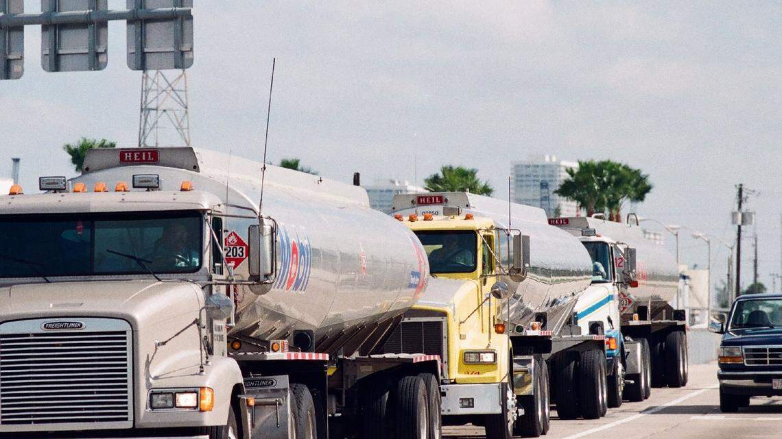 Tanker trucks form a convoy at the port of the Everglades