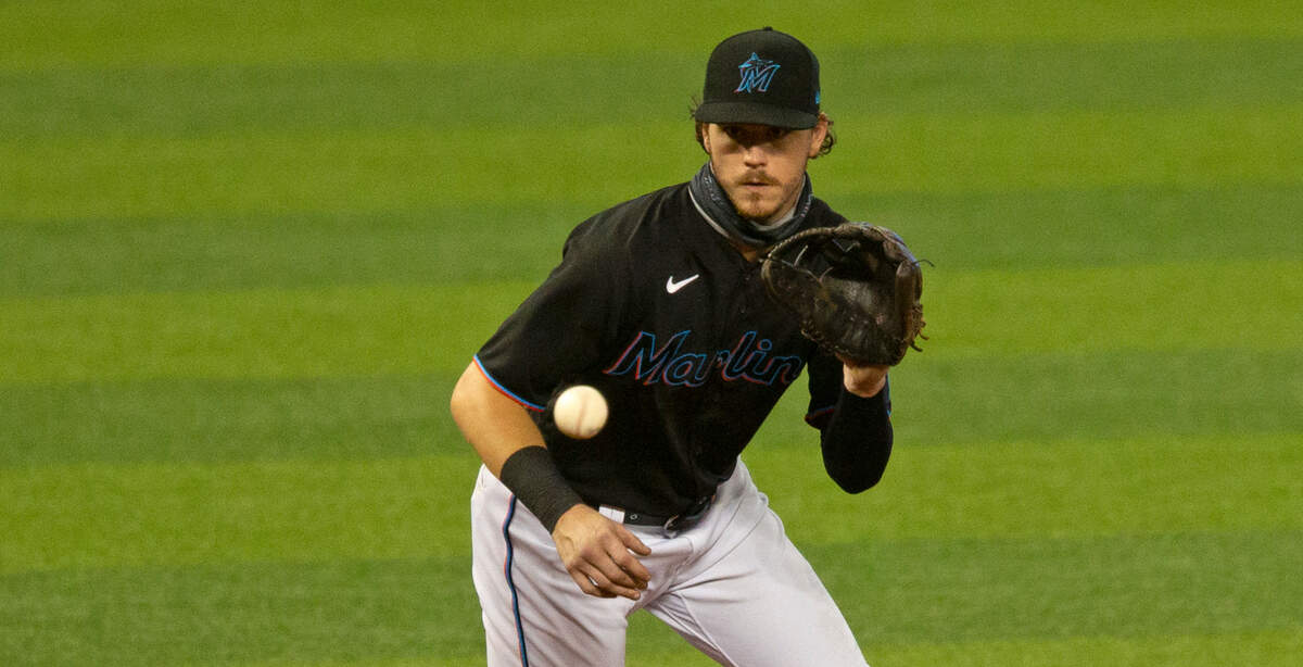 Miami Marlins third baseman Brian Anderson (15) fields a ball hits by Washington Nationals second baseman Josh Harrison (5) during the third inning of the second game of a baseball doubleheader at Marlins Park in Miami on Sunday, September 20, 2020.