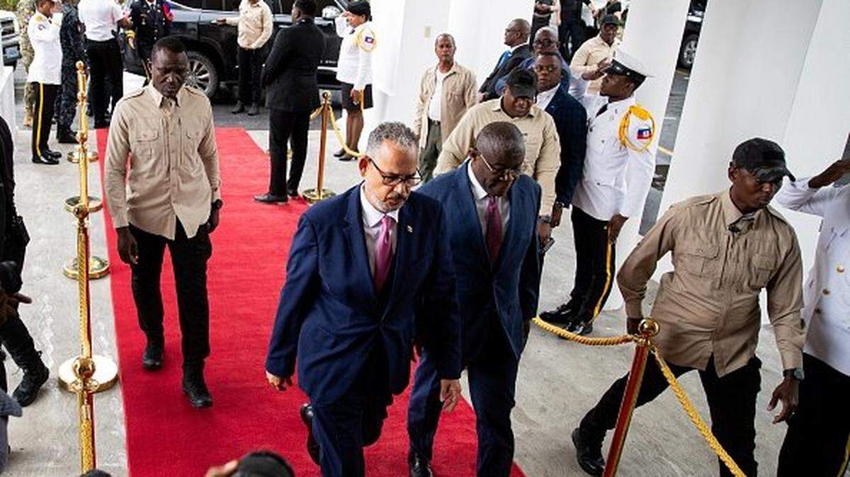 Haitian Prime Minister Alix Didier Fils-Aime (C) arrives at the end-of-term ceremony of the Presidential Transitional Council (CPT) in Port-au-Prince on February 7,2026. Nearly two years after it was created to restore order in impoverished, violence-ravaged Haiti, the transitional council is ending its work -- with no end to the crisis in sight. (Photo by Clarens SIFFROY / AFP via Getty Images)