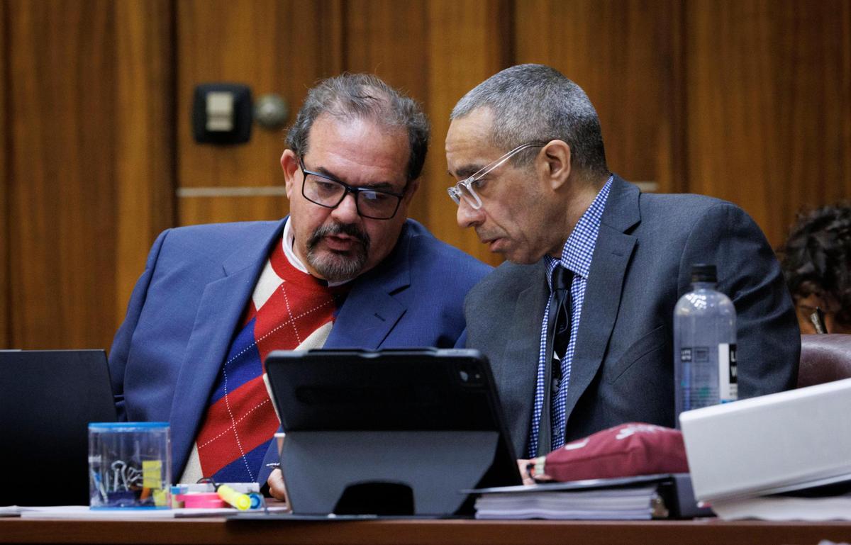 Daniel Lugo, right, talks to one of his attorneys during the death penalty resentencing case of him and Noel Doorbal on Monday, Dec. 2, 2024, at the Richard Gerstein Criminal Courthouse in Miami.