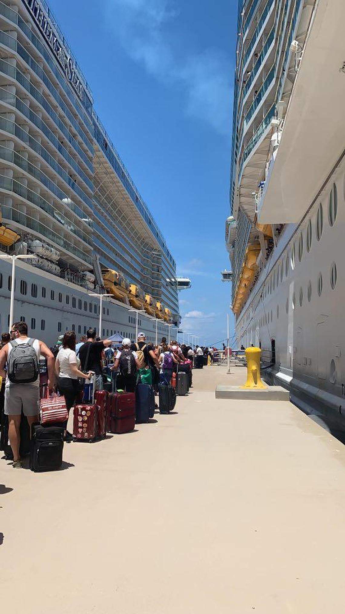Crew members transfer from the Anthem of the Seas to the Navigator of the Seas at Royal Caribbean’s private island on May 6, 2020.