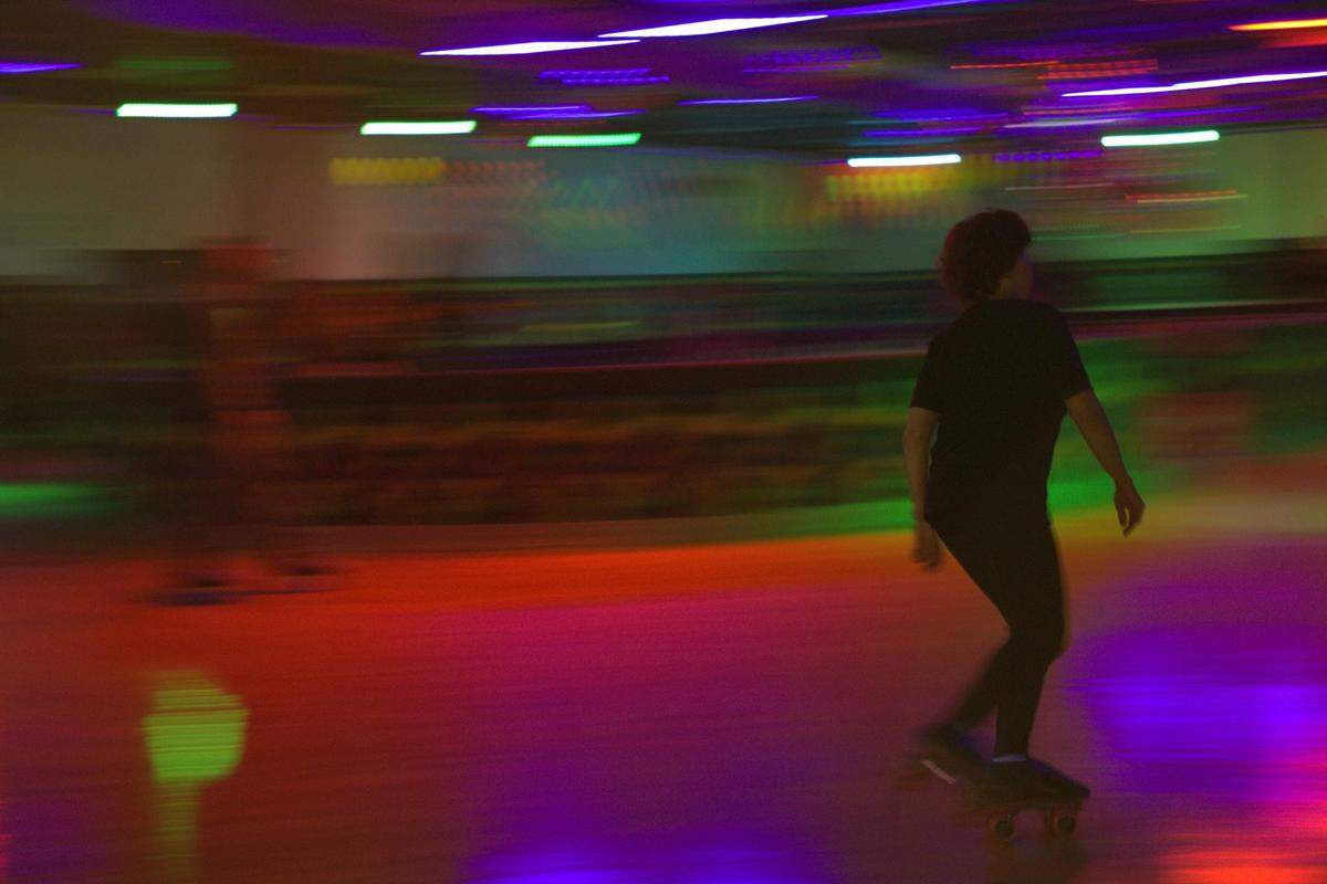 Brenda Hodgdon roller-skates around the rink at Miami Skate Rink.