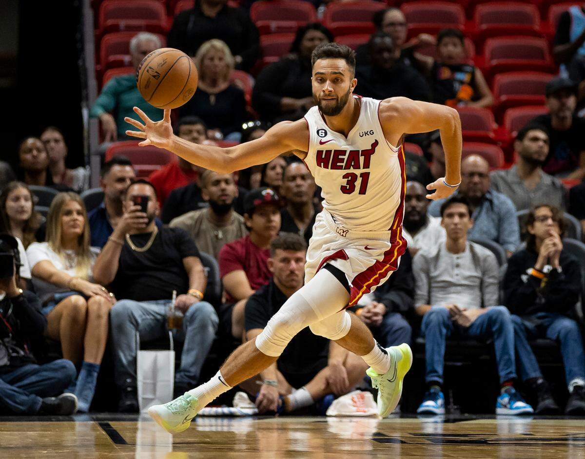 Miami Heat guard Max Strus (31) drives the ball down the court against the Houston Rockets during the first half of an NBA preseason game at FTX Arena on October 10, 2022.