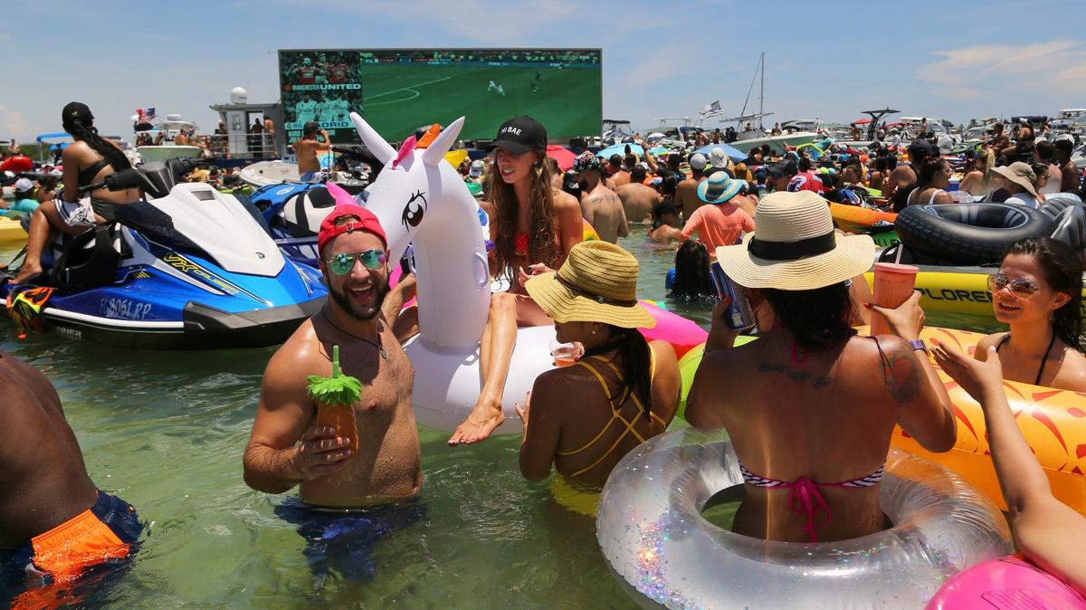 Thousands of soccer fans cool off at the Haulover sandbar as they watch the World Cup last year.