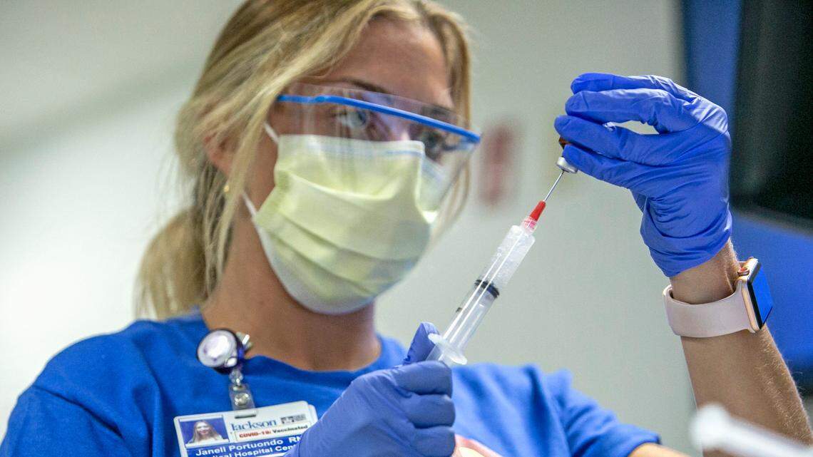A nurse prepares medication to be administered to a COVID-19 patient in the Medical Intensive Care Unit on Friday, July 23, 2021, at Jackson Memorial Hospital in Miami. COVID-19 is surging Florida and hospitalizations are rising. Hospital administrators in South Florida say more than 95 percent of the people hospitalized with COVID are unvaccinated.