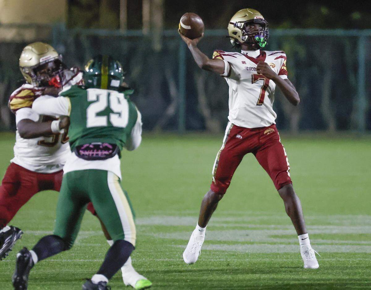 Coconut Creek quarterback Josiah Sanchius (7) sets up to pass in the first half against Mater Academy during the football playoff game in the Region 4-5A quarterfinal at Milander Park in Hialeah, Florida on Friday, November 14, 2025.