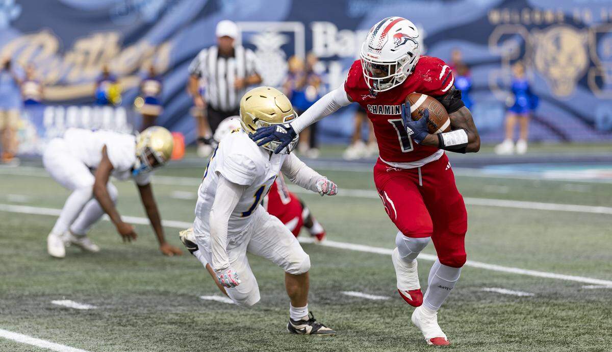 Chaminade-Madonna Lions athlete Derrek Cooper (1) runs with the ball in the first half of his Class 1A state championship football game against the Cardinal Newman Crusaders at Pitbull Stadium on Thursday, Dec. 11, 2025, in Miami, Fla.