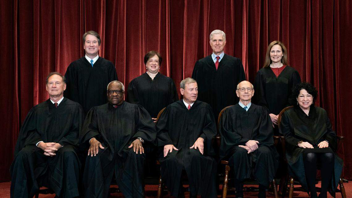In this April 23, 2021, file photo, members of the Supreme Court pose for a group photo at the Supreme Court in Washington. A family living in Justice Alito’s former New Jersey home has been receiving “harassing” mail after he and four other justices voted to overturn Roe v. Wade, police said.