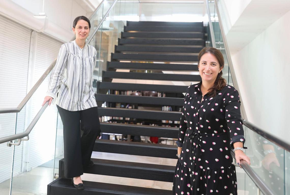 Curators Anelys Alvarez, left, and Patricia M.&nbsp;Hanna pose inside Espacio 23 where “You Know Who You Are” is currently on display. The exhibition highlights works centered around Cuban and Cuban diaspora art through history and through artists personal experiences.