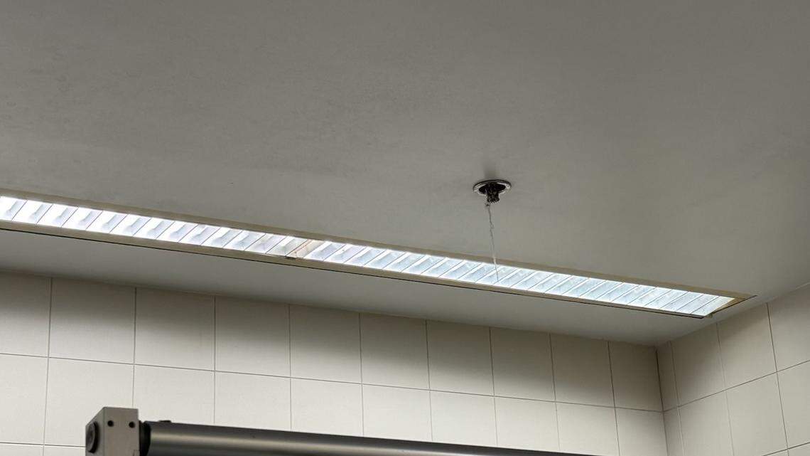 Dust hangs from a sprinkler head in a bathroom at Miami International Airport in this photo provided by Miami-Dade Commissioner Kevin Cabrera, who cited the dust string in pushing to oust the airport’s current cleaning company during a committee hearing on Wed., Feb. 12, 2025.