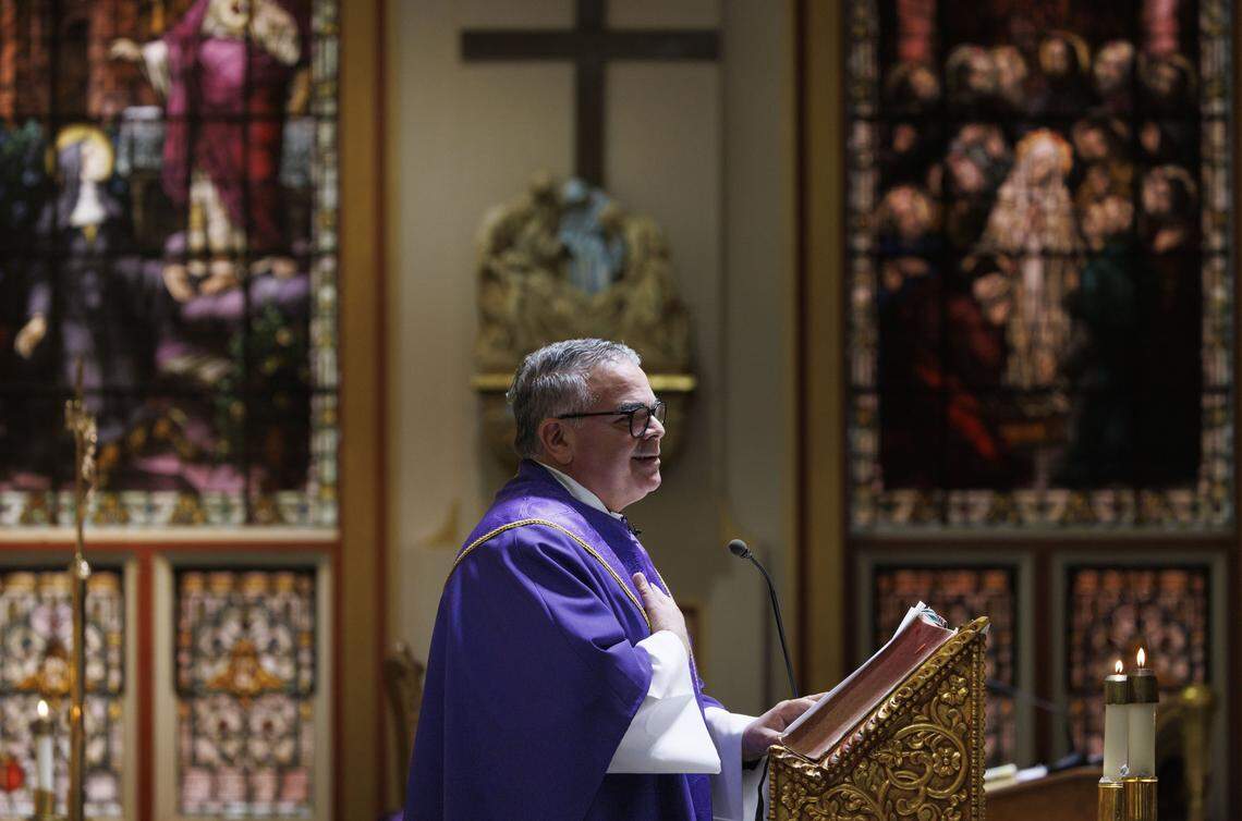 Fr. Orlando Portalatin, a Jesuit priest, leads Ash Wednesday mass on Wednesday, Feb. 18, 2026, at Gesu Catholic Church in downtown Miami. 