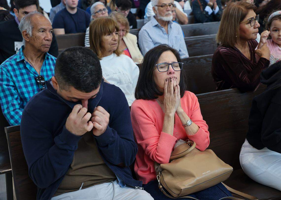 A man wipes away tears as members of the Venezuelan community gather to pray during the 10 a.m. Sunday Mass, officiated by the Reverend Israel Mago, one day after the United States attacked Venezuela and captured Venezuelan leader Nicolás Maduro and his wife, Cilia Flores, on Sunday, Jan. 4, 2026, in Doral, Florida.