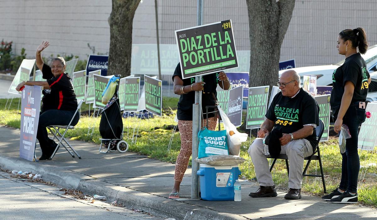 Supporters of candidates camped outside the voting precinct at the Allapattah Branch Library in Miami on Tuesday, as voters chose from seven candidates running for the Miami City Commission in District 1.