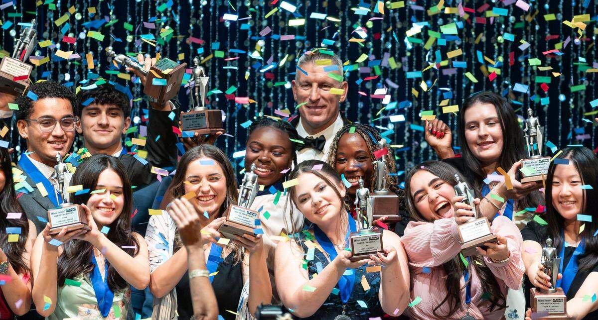 Silver Knight winners celebrate on stage with Bob McFarlin, Executive Vice President for McClatchy and President of Herald Charities, during the Miami Herald & el Nuevo Herald 67th&nbsp;Silver&nbsp;Knight&nbsp;Award Ceremony at the James L.&nbsp;Knight&nbsp;Center on Wednesday, May 14, 2025, in downtown Miami, Fla.